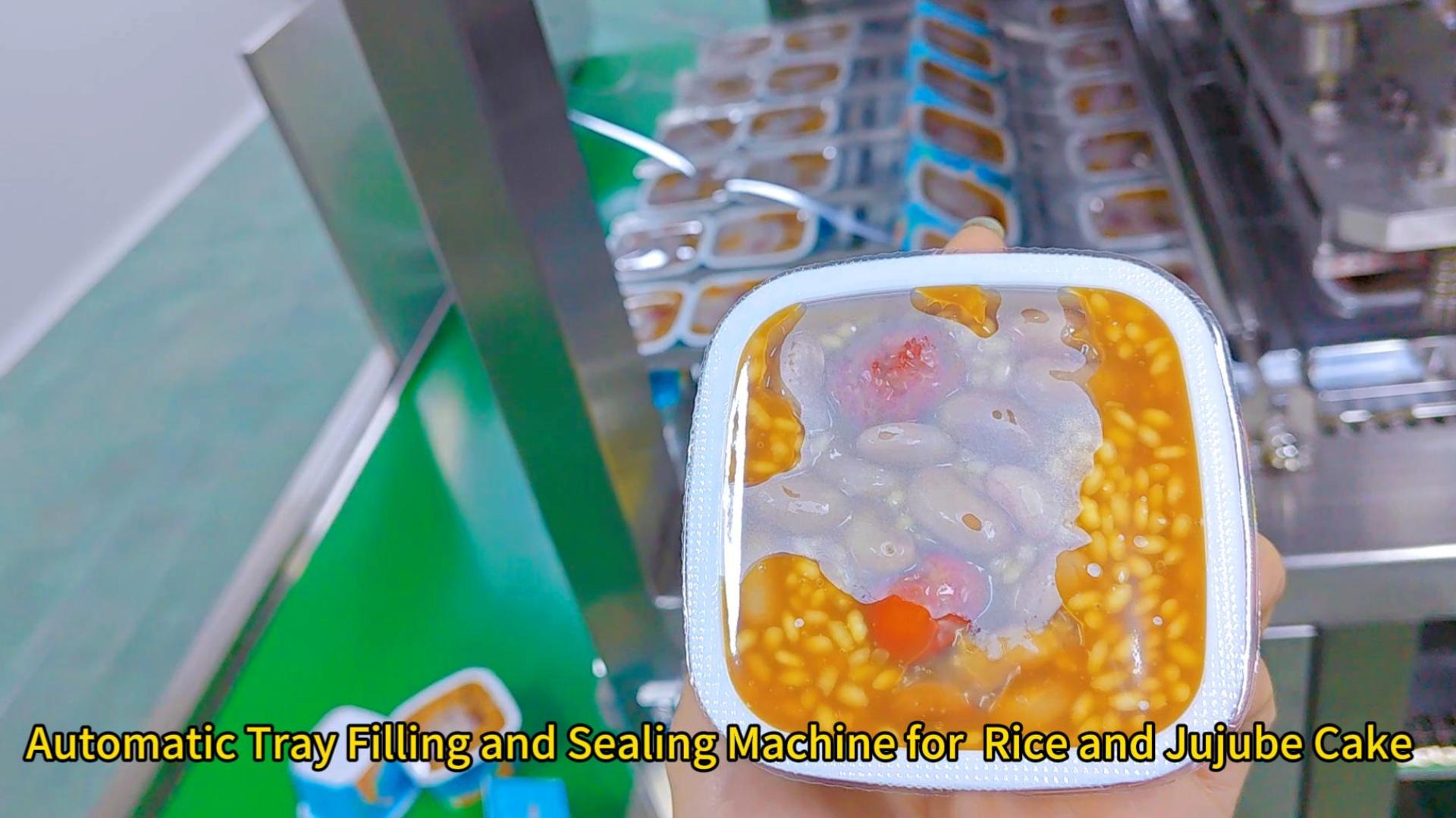 Automatic tray filling and sealing machien for rice and jujube cake